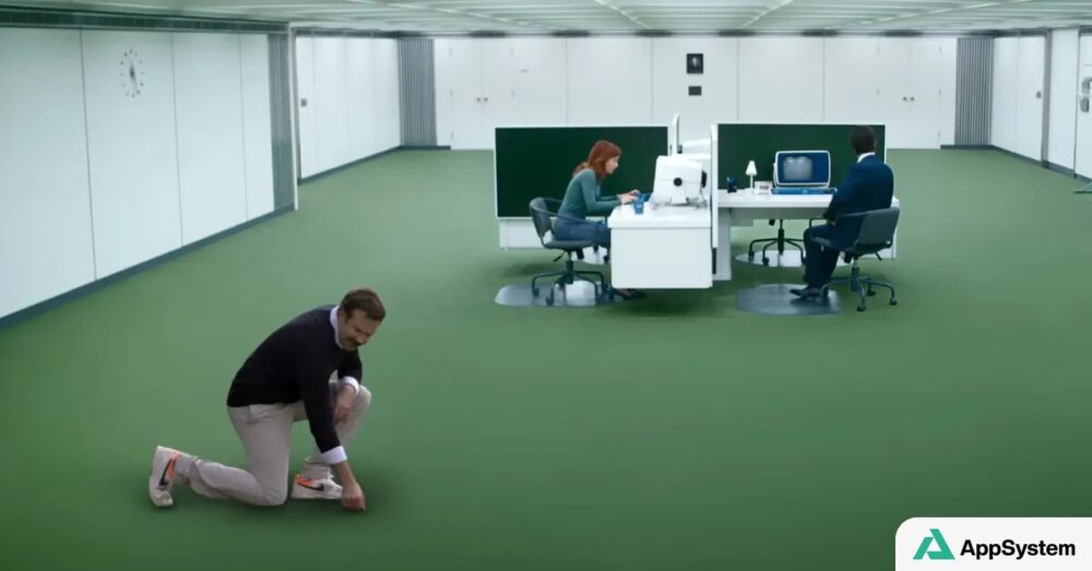 Ted Lasso à genoux dans les bureaux futuristes de Severance