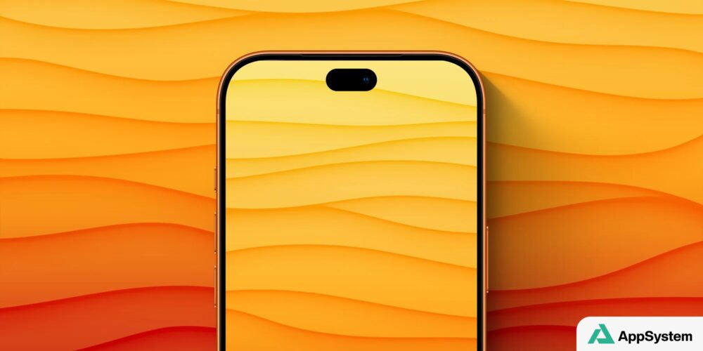 Vue rapprochée d’un iPhone orange avec écran et Dynamic Island