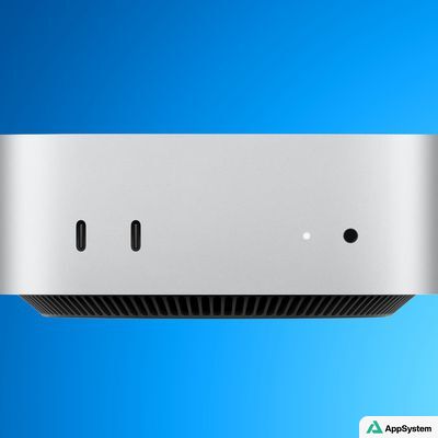 Vue rapprochée du Mac mini Apple sur fond bleu