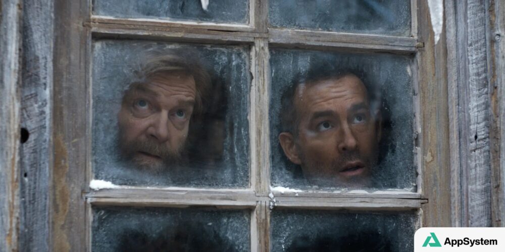 Deux hommes regardent à travers une fenêtre couverte de givre