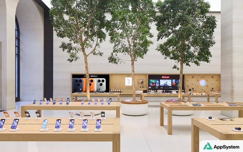 Intérieur d’un Apple Store avec présentoirs muraux et produits exposés