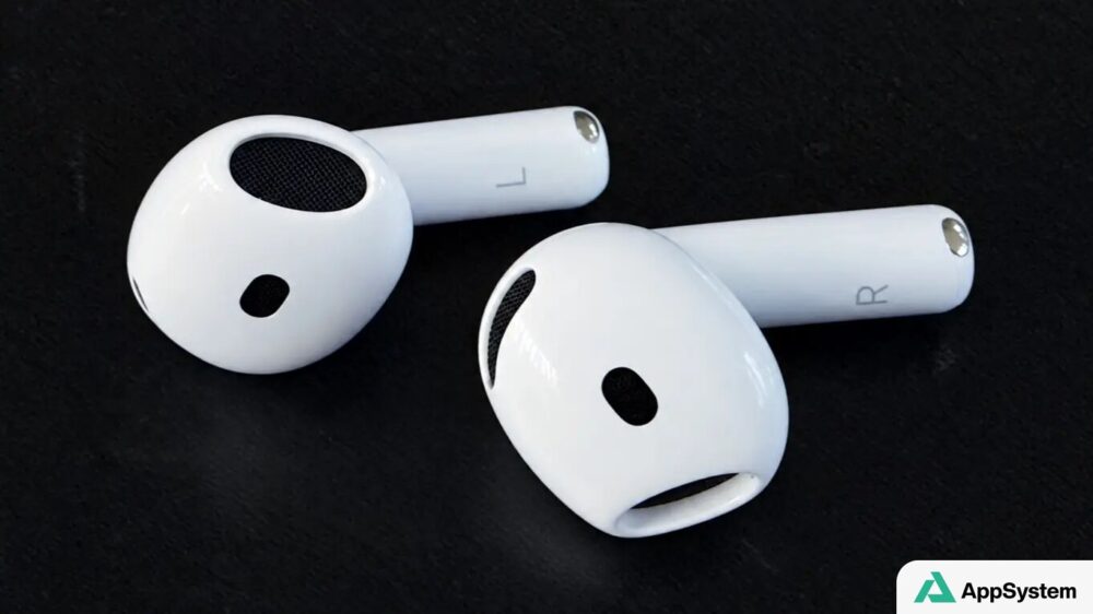 Deux écouteurs AirPods 5 blancs posés sur une surface noire.
