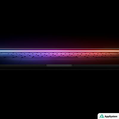 Ordinateur portable Apple présenté dans un éclairage coloré