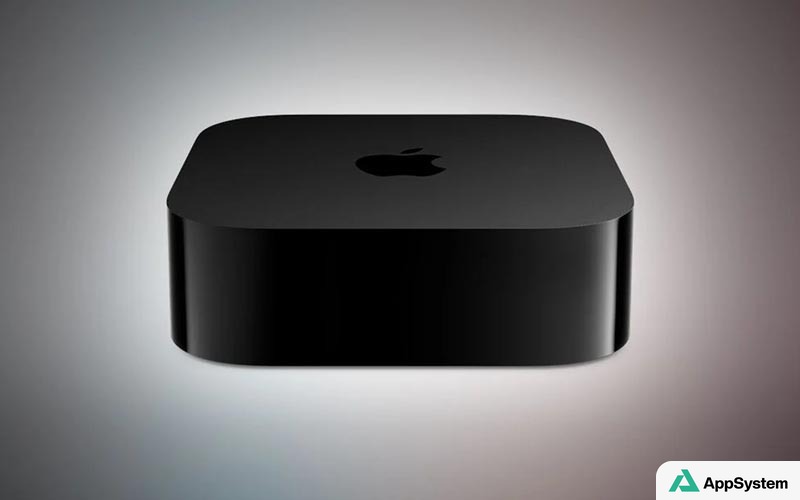Apple TV 4K noire vue de face sur fond dégradé