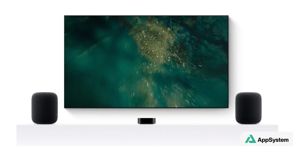 Téléviseur entouré de deux HomePod et d’un boîtier Apple TV