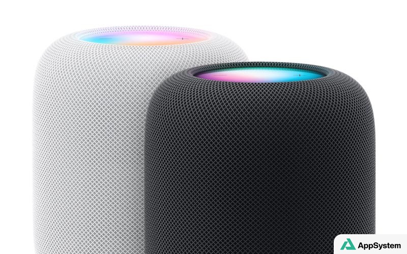 Deux enceintes HomePod, blanche et noire, avec anneaux lumineux