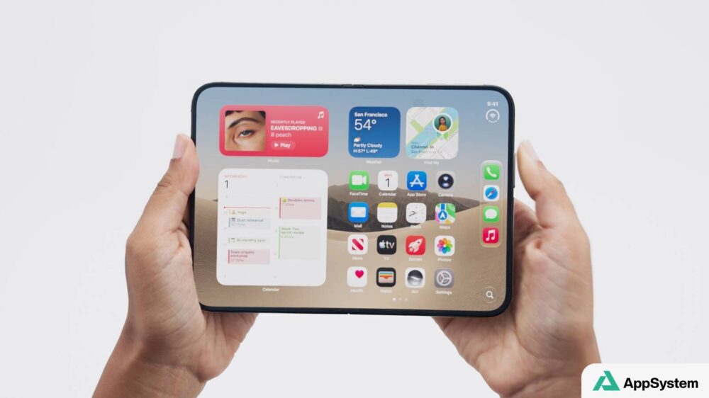 iPhone Duo déplié, tenu à deux mains avec écran d’accueil visible