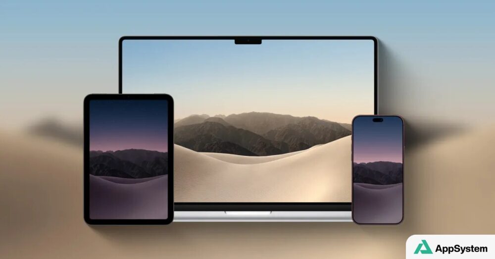 Trois appareils Apple affichent un paysage désertique en fond d’écran