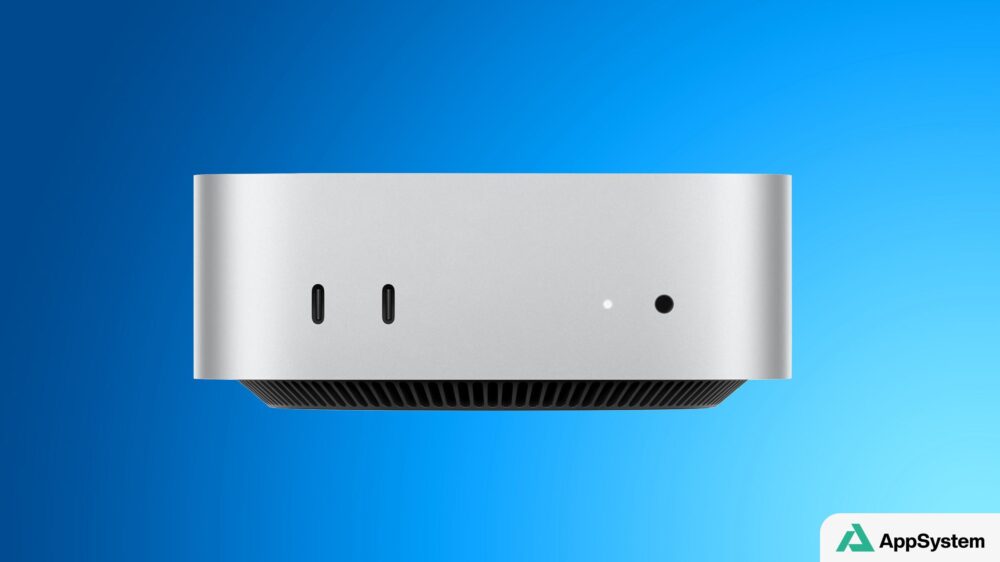 Vue frontale du Mac mini argenté avec ports USB-C et ventilation.