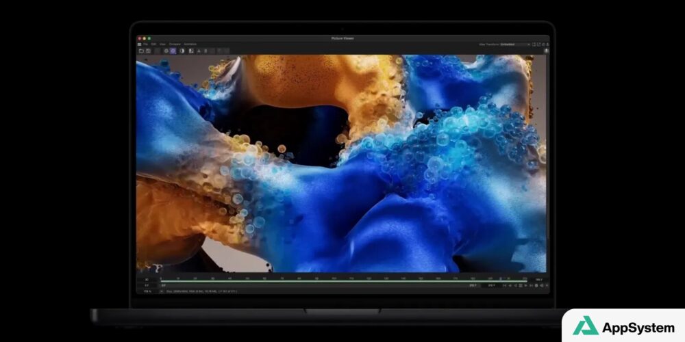 MacBook Pro ouvert affichant une image abstraite colorée