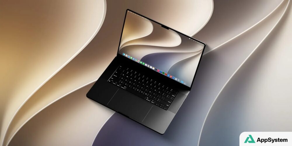 MacBook ouvert présentant l’interface macOS et son fond d’écran