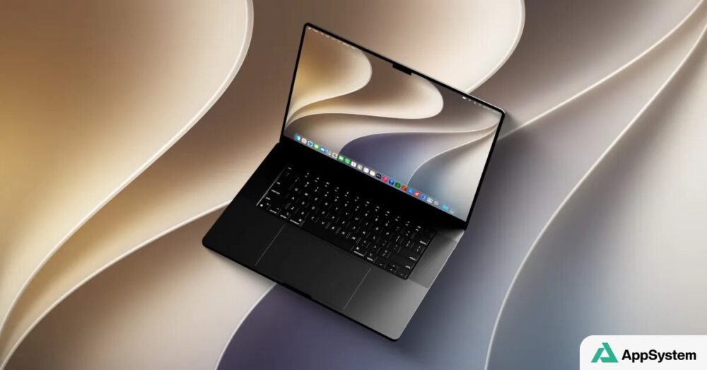 MacBook affichant un fond d’écran macOS sur fond abstrait