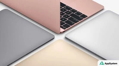 Plusieurs MacBook colorés présentés vus de dessus