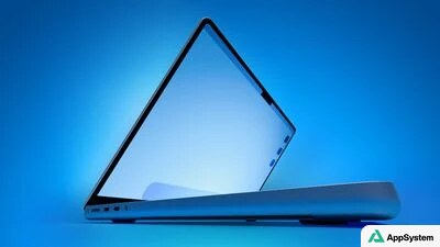 MacBook ouvert vu de profil sur fond bleu