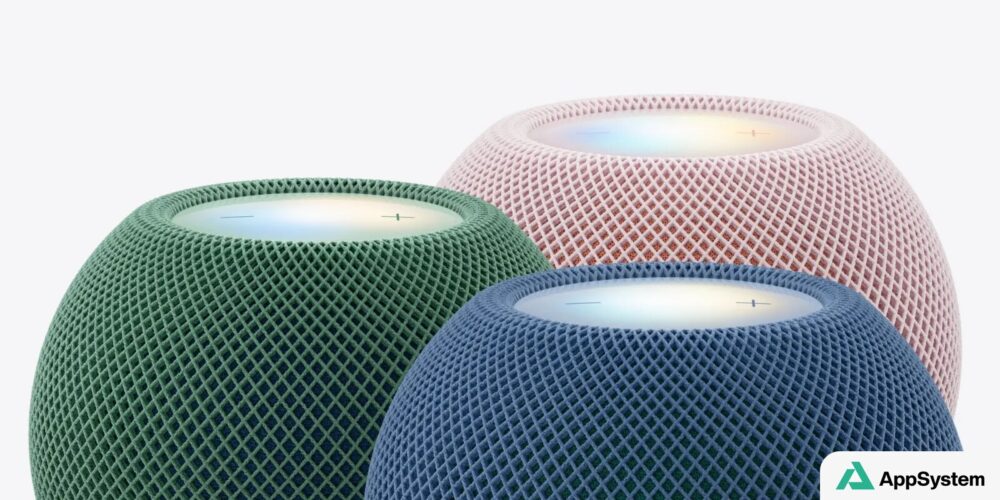 Trois enceintes HomePod mini 2 colorées sur fond clair