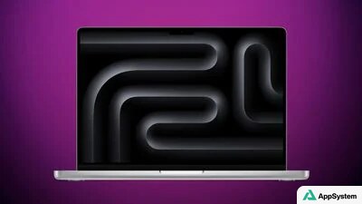 MacBook présenté de face, écran sombre aux formes abstraites